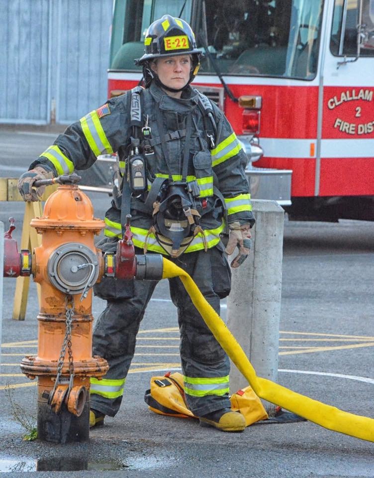 May contain: helmet, person, fireman, fire hydrant, and hydrant