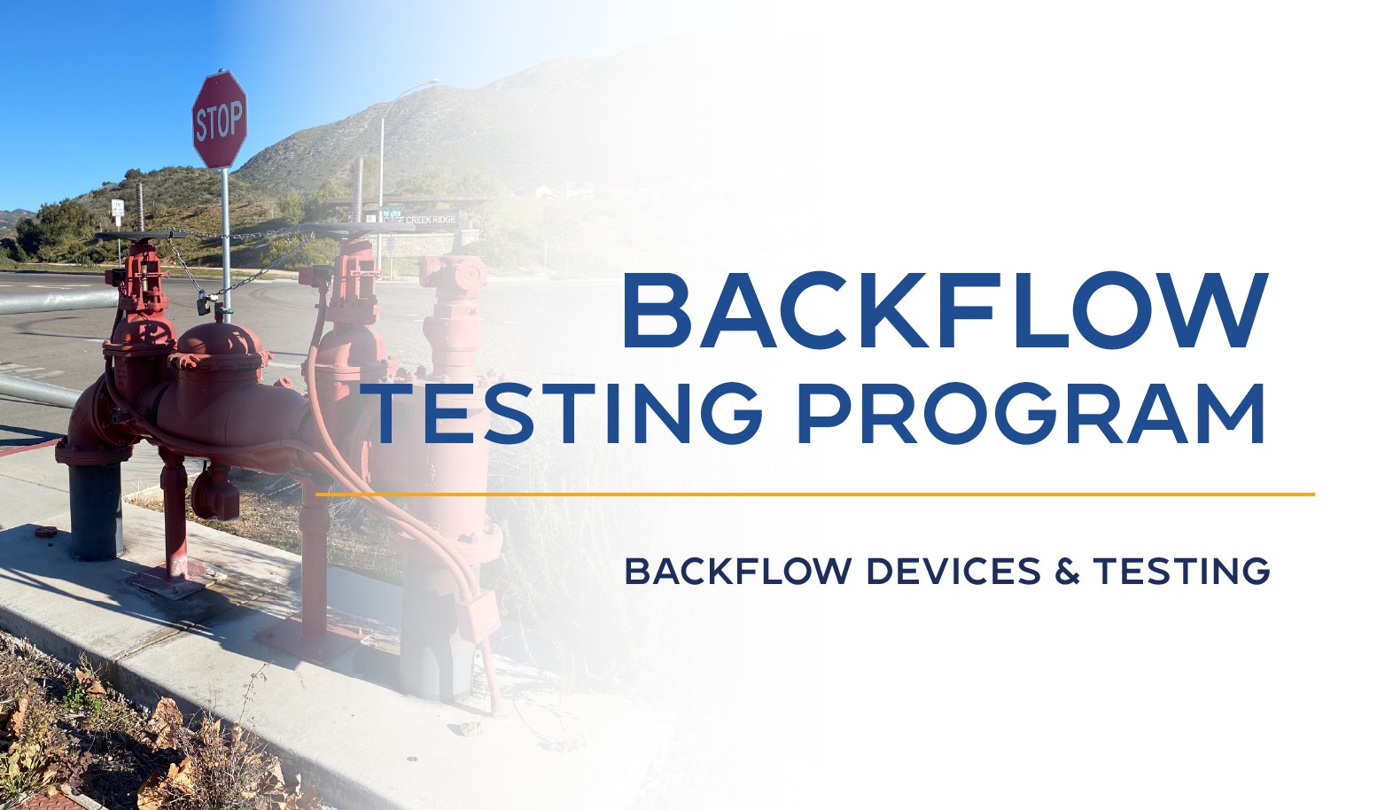 Backflow Testing Program signage with pipes and a stop sign in a scenic outdoor area.