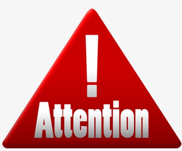 A red triangular warning sign with an exclamation mark and the word "Attention" prominently displayed.