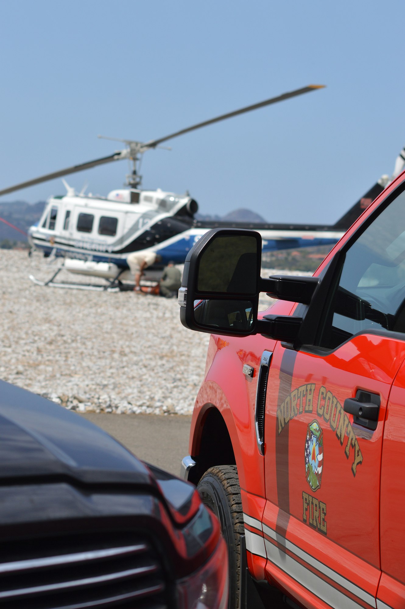 May contain: helicopter, transportation, vehicle, aircraft, car, automobile, person, human, and tire
