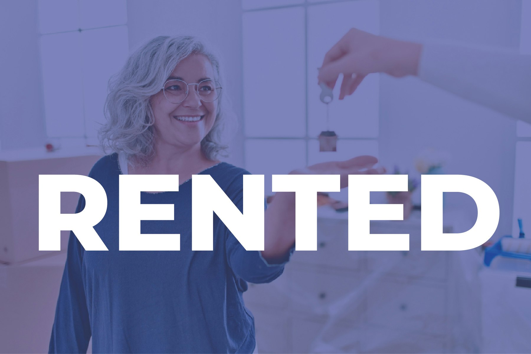 A smiling woman receives keys; the large text "RENTED" is overlaid.