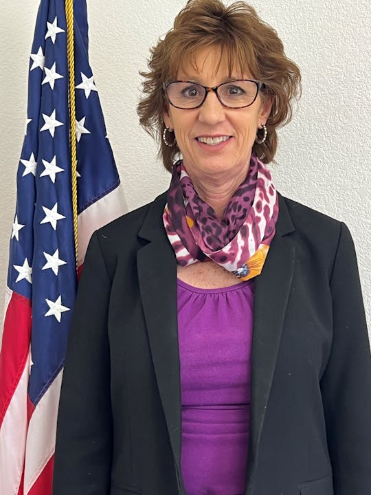 May contain: clothing, scarf, blazer, coat, jacket, american flag, flag, adult, female, person, woman, face, and head