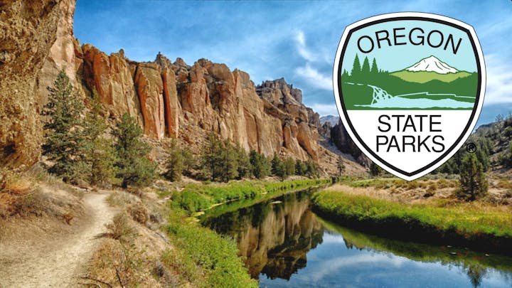 Oregon State Parks logo with scenic river, trail, and towering cliffs.