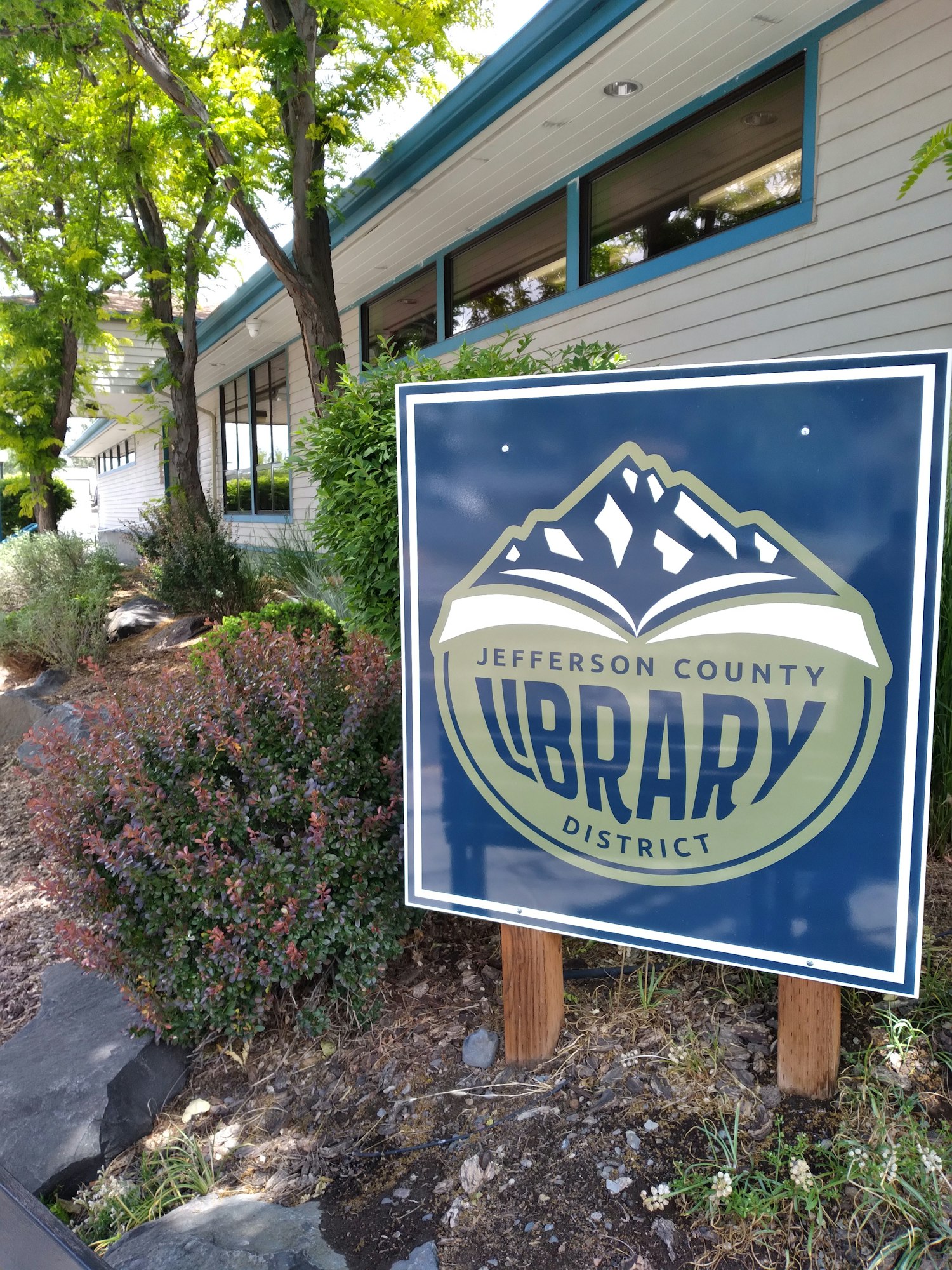 Photo of the old logo sign for JCLD