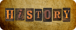 The word "HISTORY" in vintage letter tiles on a textured background.