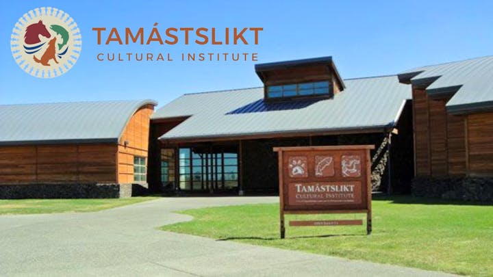 Exterior view of Tamástslikt Cultural Institute with a clear blue sky.