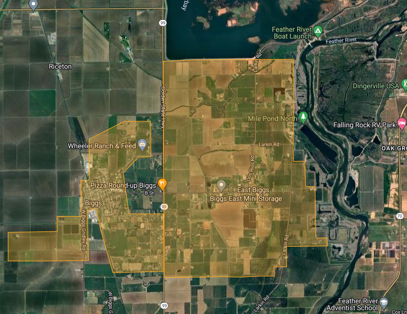Satellite map showing agricultural fields, a river, roads, and labeled places including Biggs and businesses.