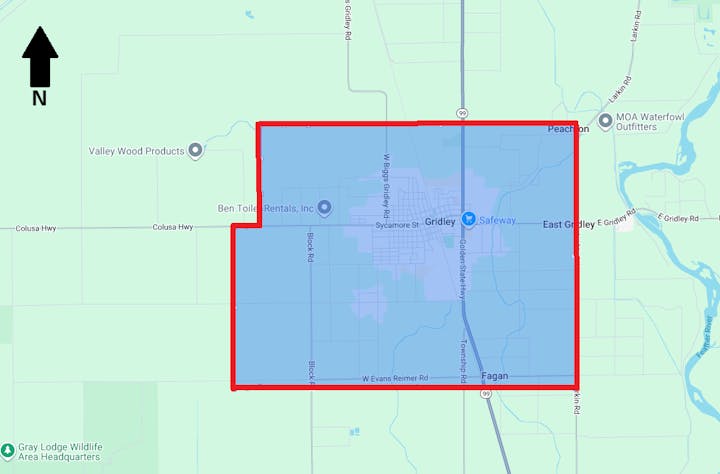 Map showing a highlighted area around Gridley, with roads, businesses, and a compass arrow pointing north.