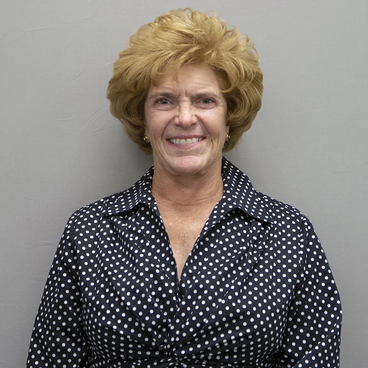 headshot of Gail Whipple in polka dot blouse