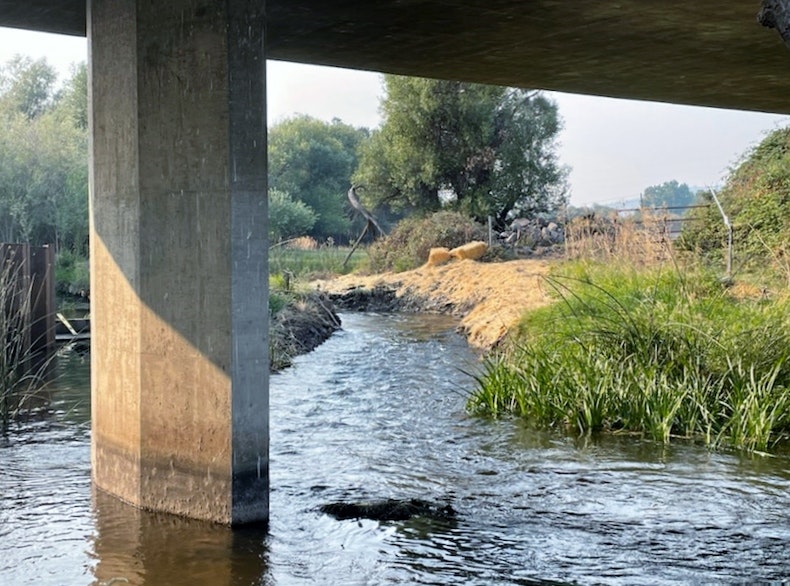 Looking upstream at the temporary side channel during construction