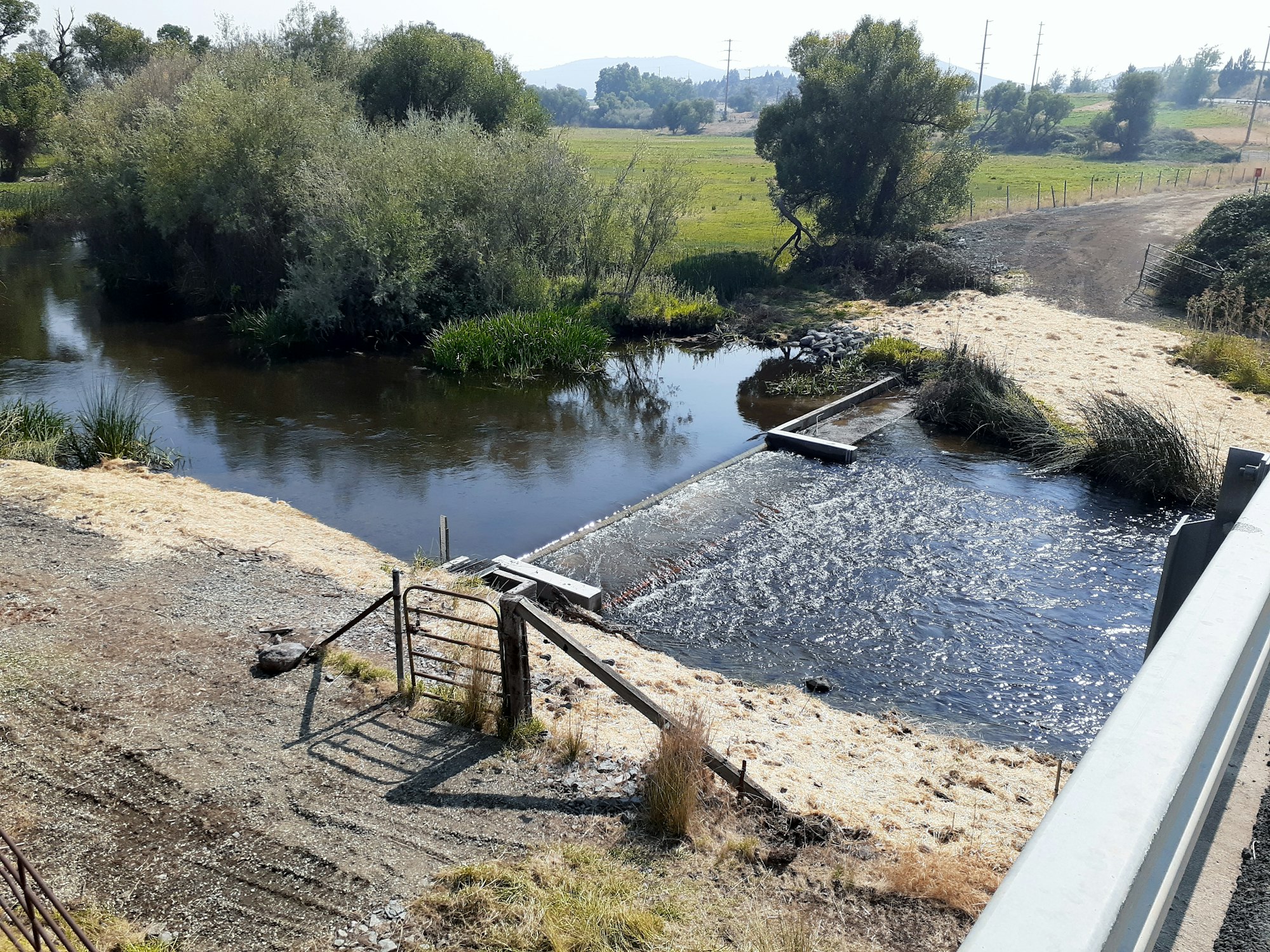 May contain: water, nature, outdoors, land, ditch, and road