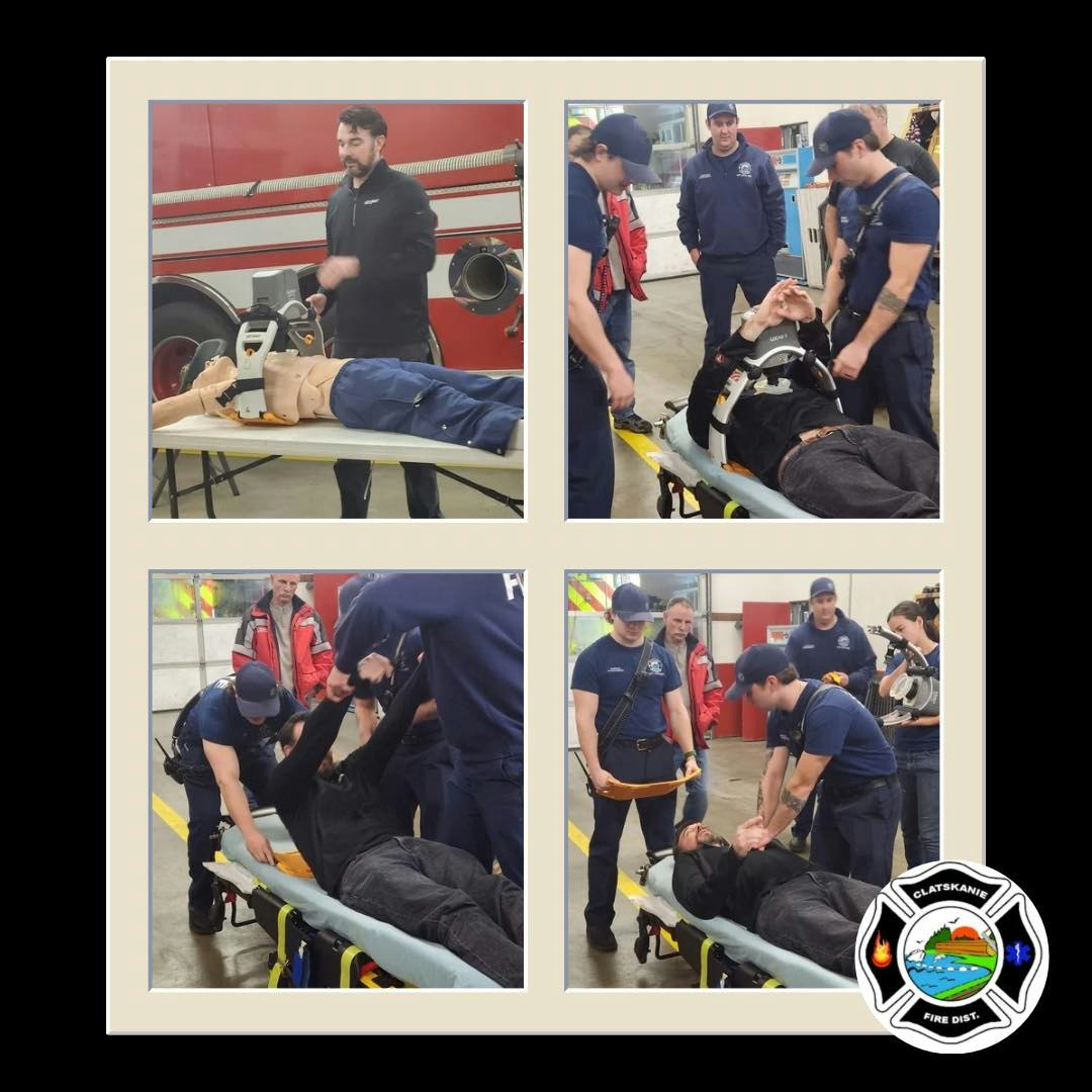 Firefighters conduct a training session with a CPR dummy, practicing emergency response techniques and patient handling.