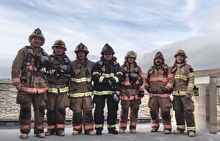 May contain: person, human, helmet, clothing, apparel, and fireman