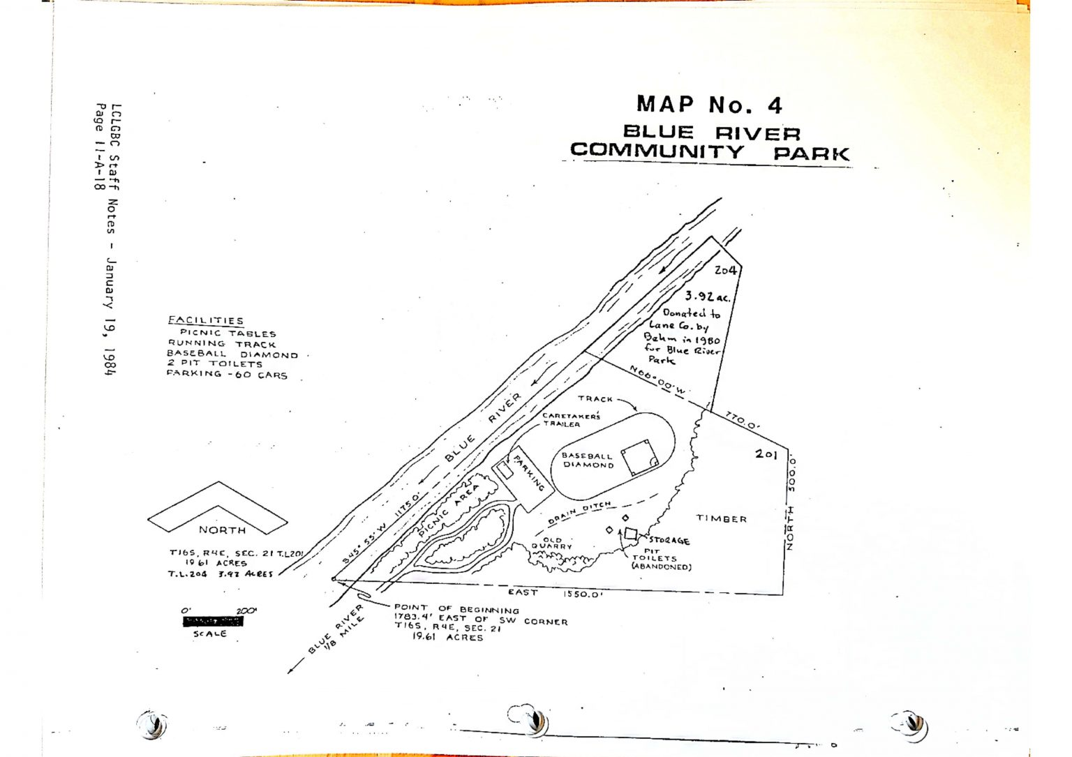 A map of Blue River Community Park, detailing facilities like picnic tables, a track, a baseball diamond, toilets, and parking.