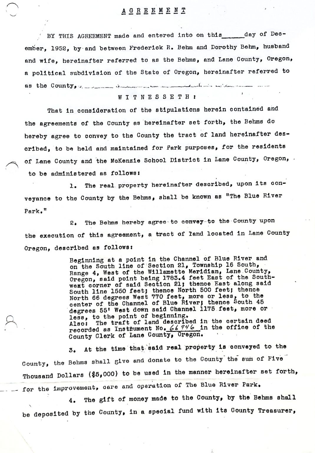 A legal agreement document regarding land conveyance for park purposes and a monetary donation for Blue River Park.