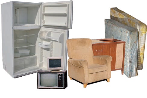 An open fridge, two old TVs, a beige armchair, a wooden cabinet, and two mattresses.