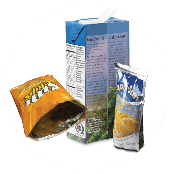 A bag of chips, an orange juice carton, and a juice pouch on a white background.