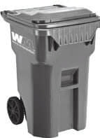 A large gray wheeled trash bin with a closed lid.