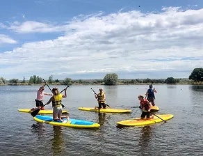 people on canoes in water