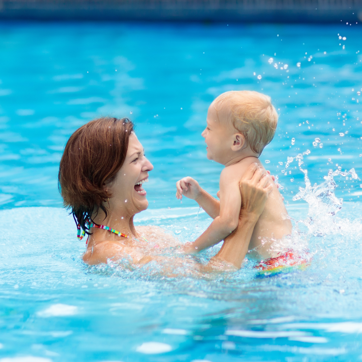 May contain: leisure activities, person, sport, swimming, water, water sports, summer, pool, face, head, photography, portrait, swimming pool, baby, clothing, and swimwear