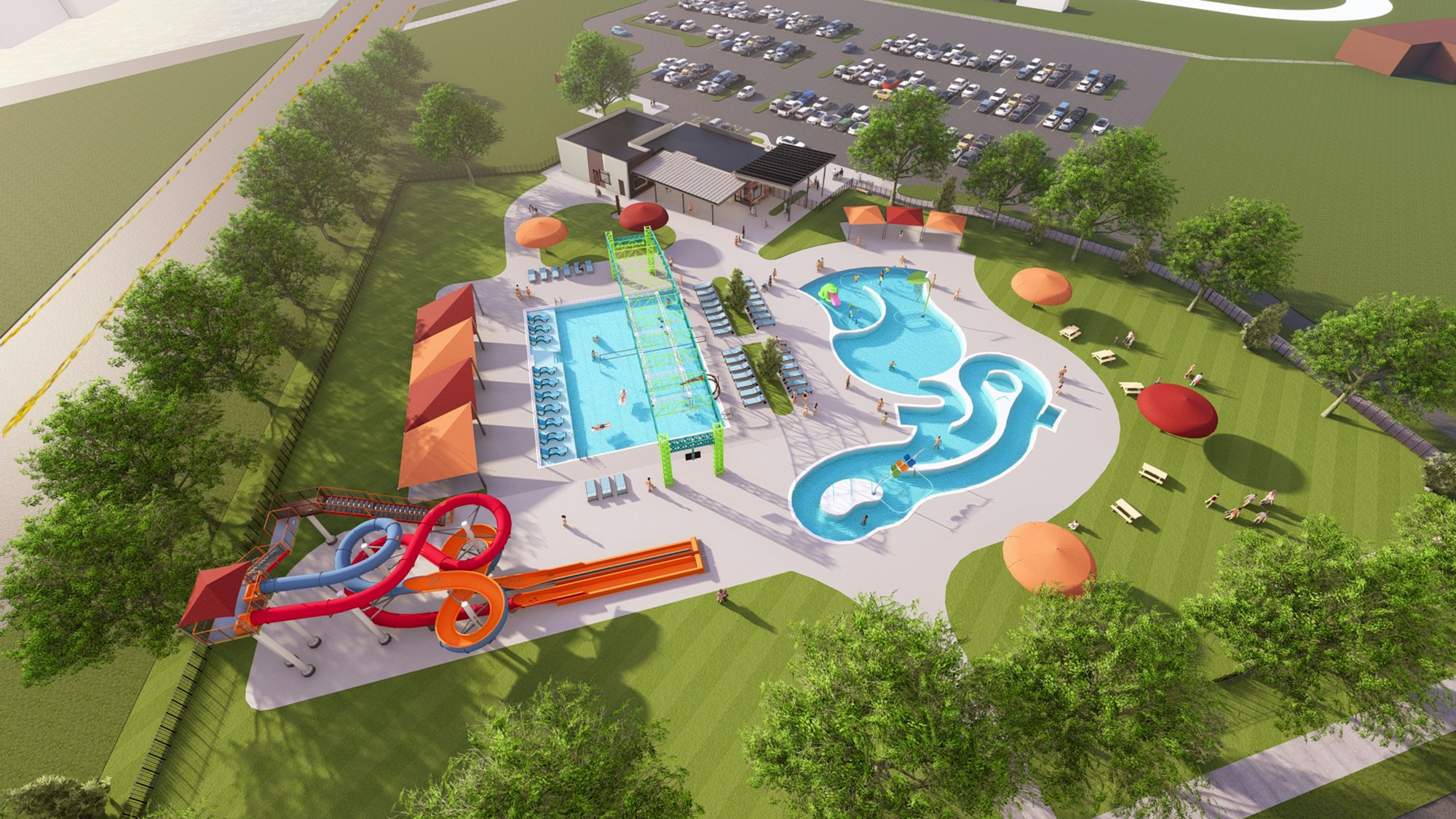 Aerial view of a water park with pools, slides, loungers, picnic tables, and trees, adjacent to a parking lot.