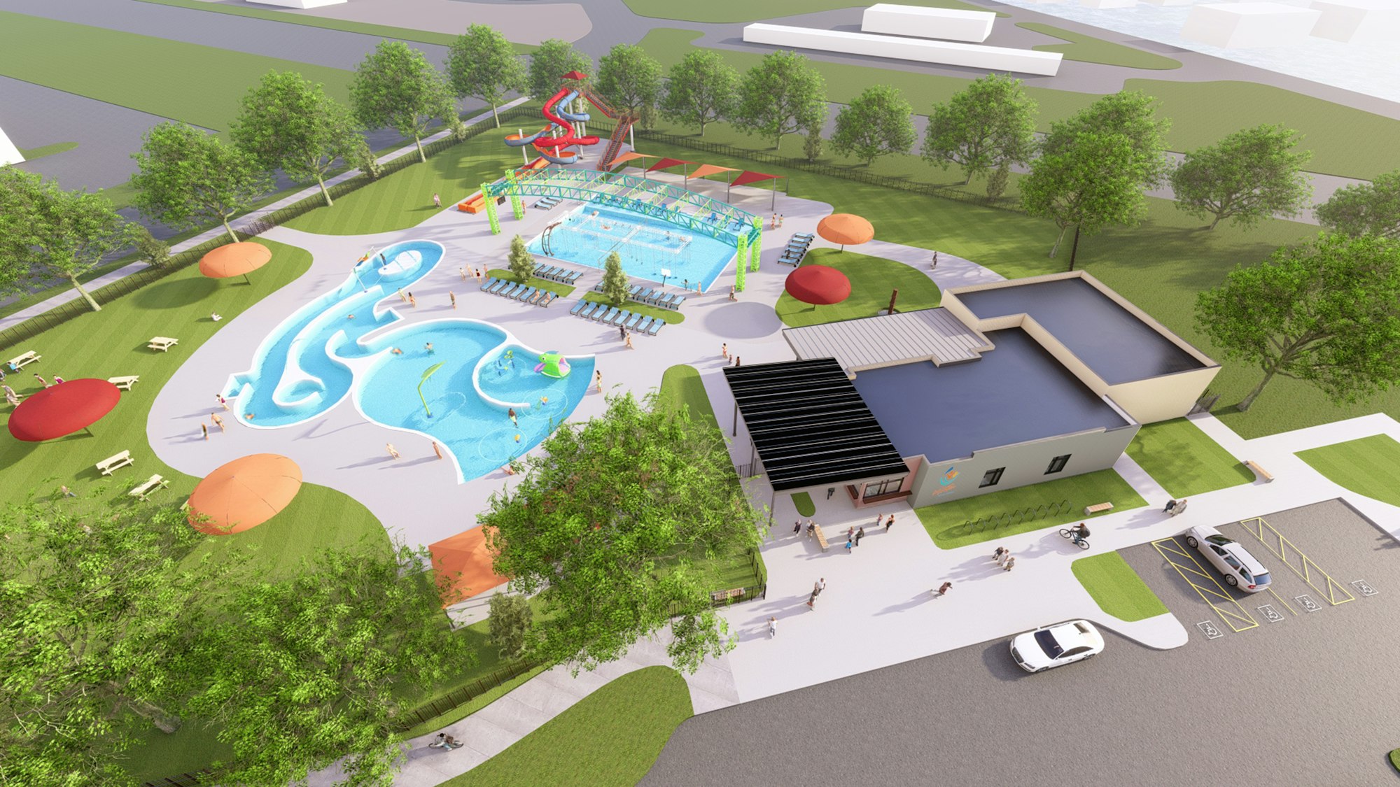 Aerial view of a water park with pools, slides, lounge chairs, and a building, surrounded by grass and trees.