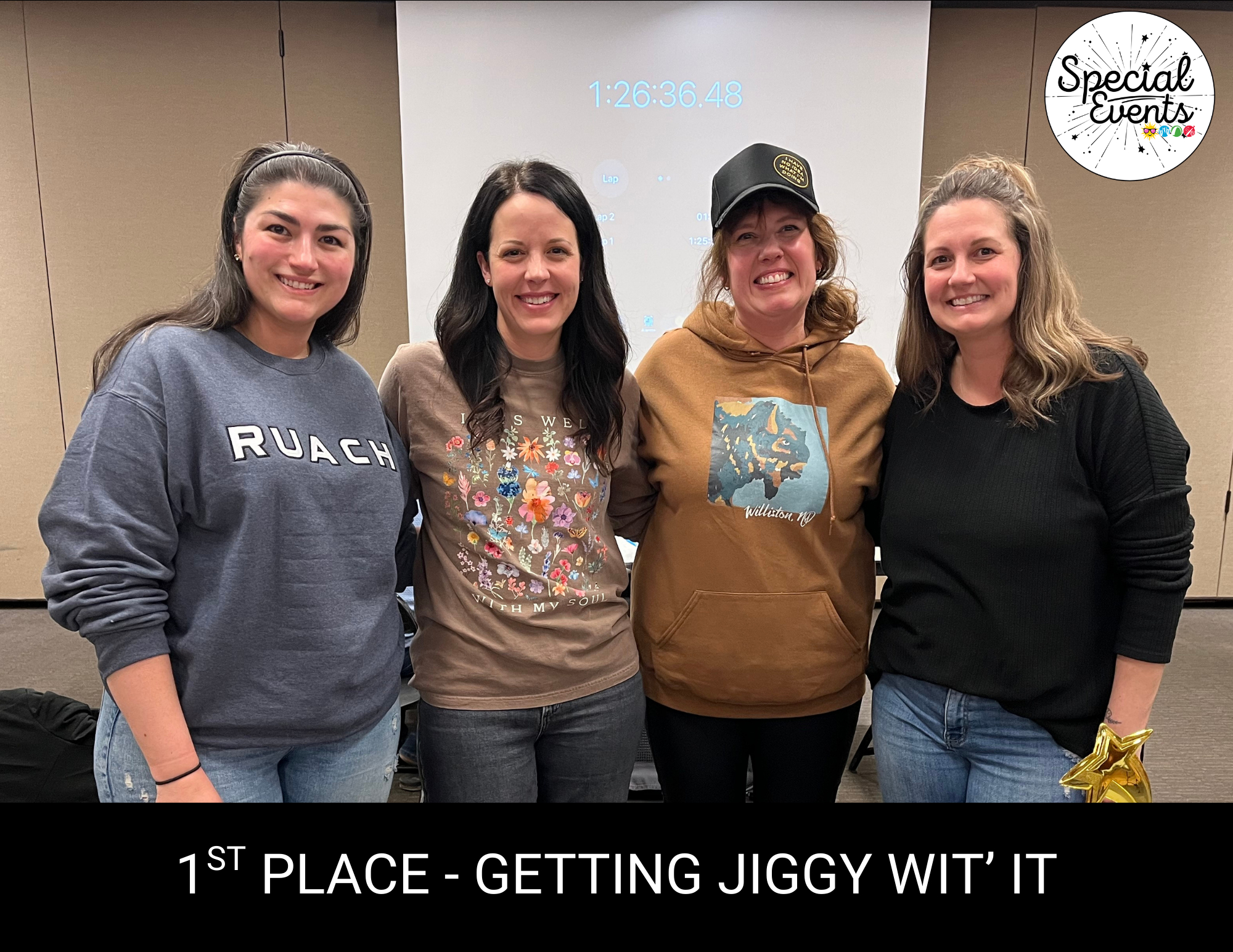 Four women celebrating their 1st place win for "Getting Jiggy Wit' It" at a special events gathering.