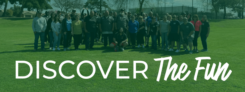 A group of people outdoors with the text "DISCOVER The Fun" overlaying the image.