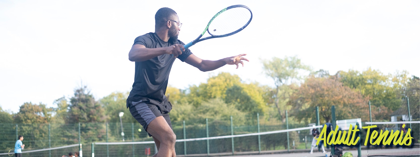 A person playing tennis on an outdoor court. Text reads "Adult Tennis."