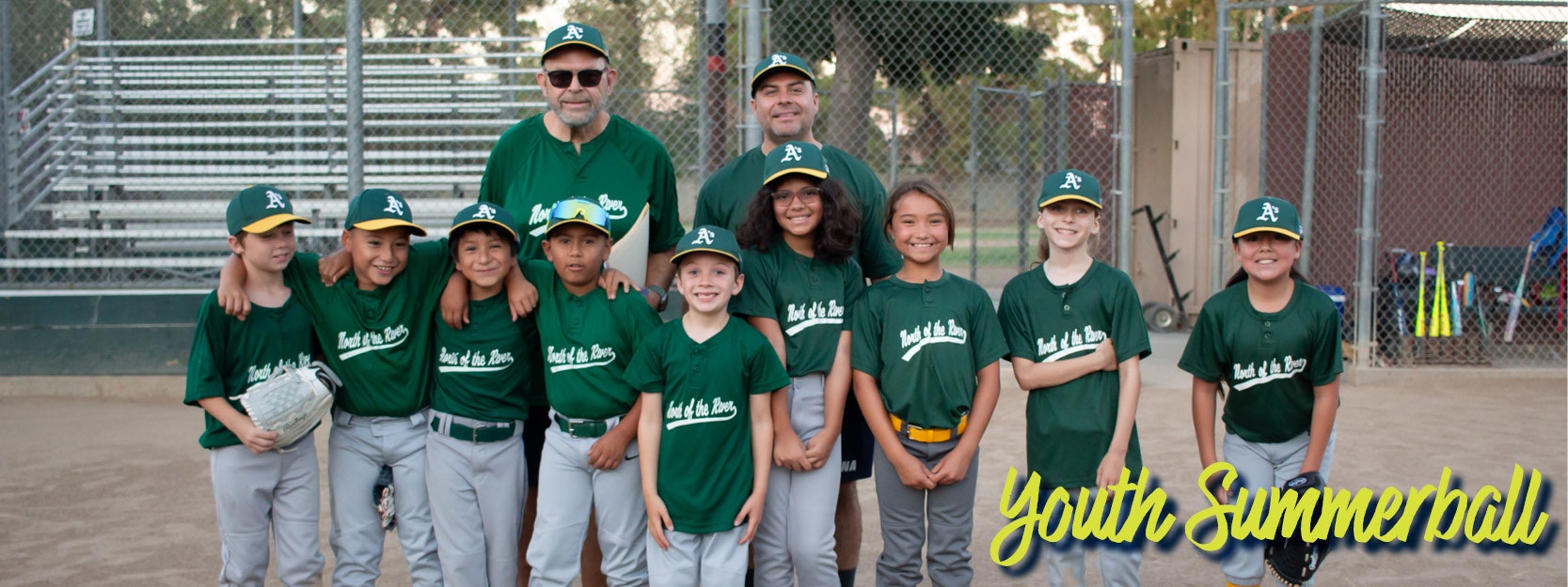 A youth baseball team in green uniforms poses with two adults in a park. "Youth Summerball" text is overlaid.