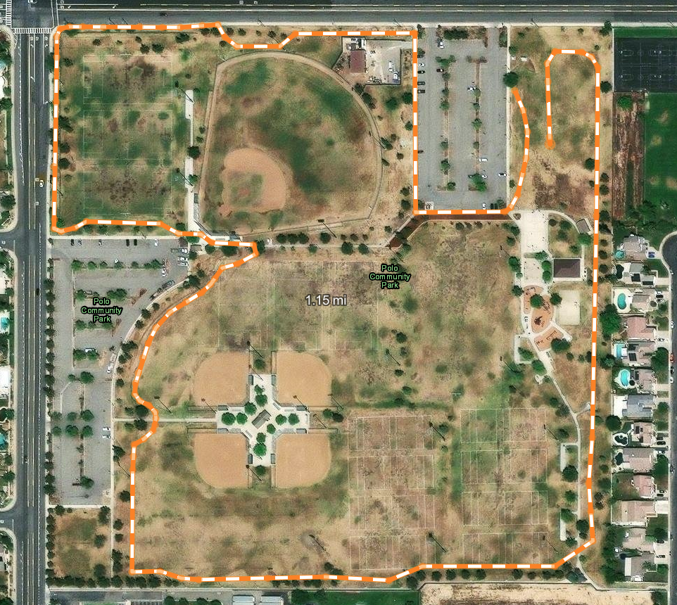 An aerial view of Polo Community Park, showing sports fields, parking, and walking paths, with a highlighted boundary.