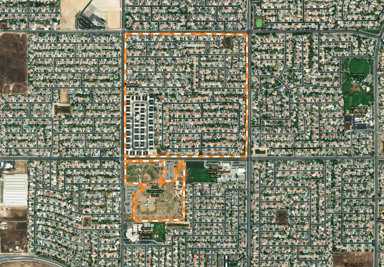 The image shows a satellite view of a residential area with streets, a park, and two elementary schools marked.