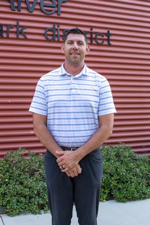 May contain: face, head, person, photography, portrait, clothing, pants, standing, adult, male, man, sleeve, and shirt
