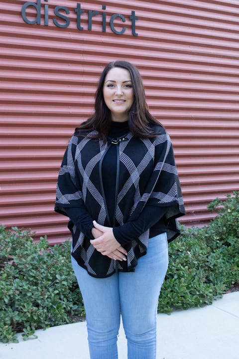 May contain: clothing, pants, blouse, long sleeve, sleeve, face, happy, head, person, smile, fashion, coat, jacket, jeans, adult, female, woman, photography, and portrait