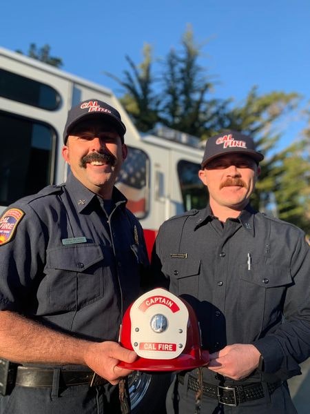 May contain: person, human, helmet, clothing, apparel, hat, police, and military