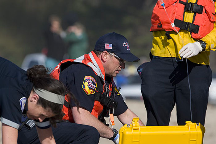 Firefighter Paramedic performing a patient assessment