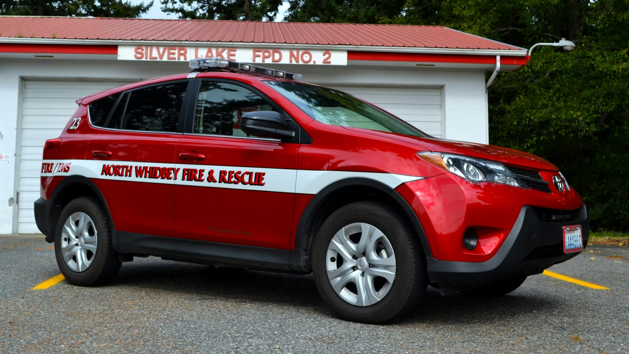 Red fire and rescue SUV labeled "North Whidbey Fire & Rescue" parked at "Silver Lake FPD No. 2" station.