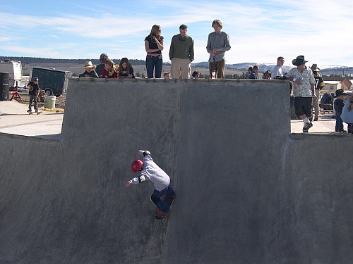 May contain: baseball cap, cap, clothing, hat, people, person, and pants
