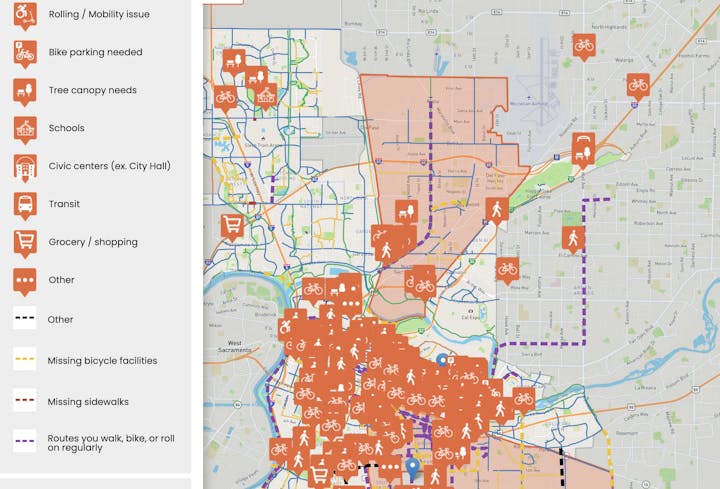The map highlights various mobility issues, bike facilities, and community resources like schools and grocery stores in the area.