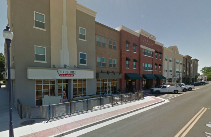 May contain: urban, building, neighborhood, human, person, road, town, and city