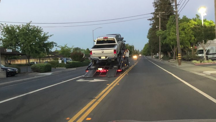 May contain: vehicle, truck, transportation, person, human, road, automobile, and car