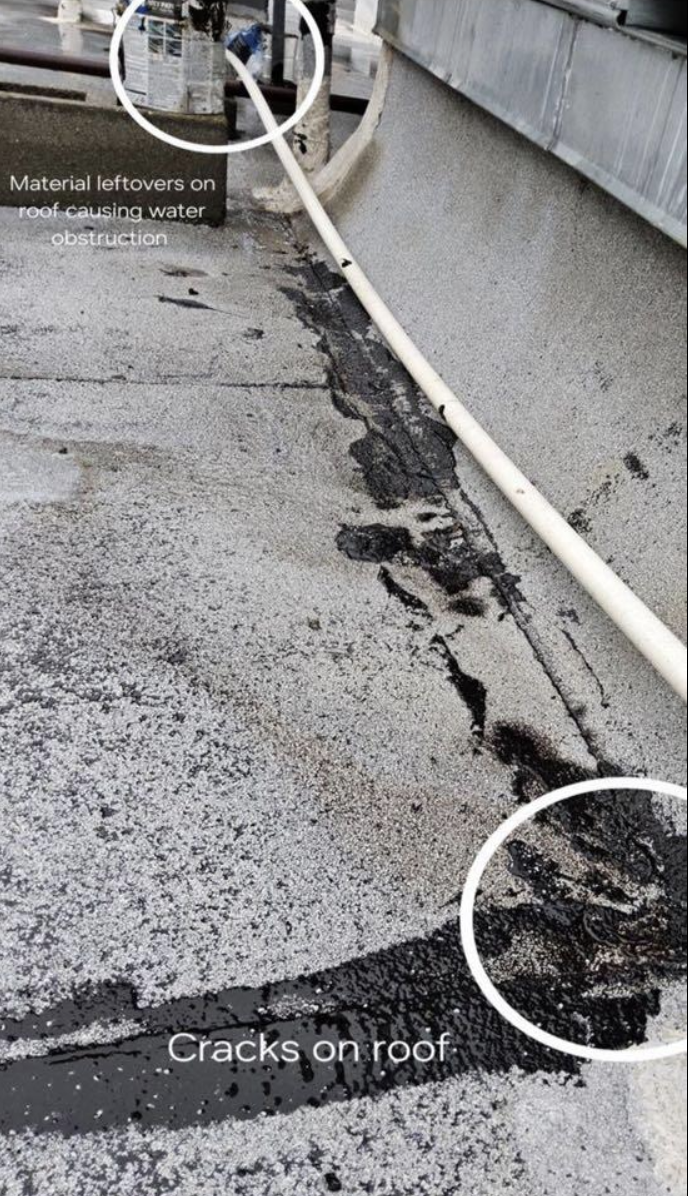 Roof with cracks and material leftovers causing water obstruction, circled for emphasis.