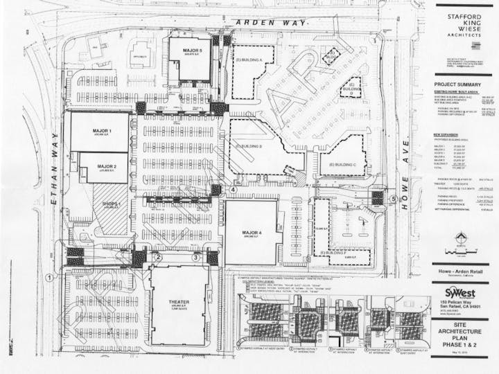 The image is a site plan for a retail development, showing building layouts, parking areas, and project details.