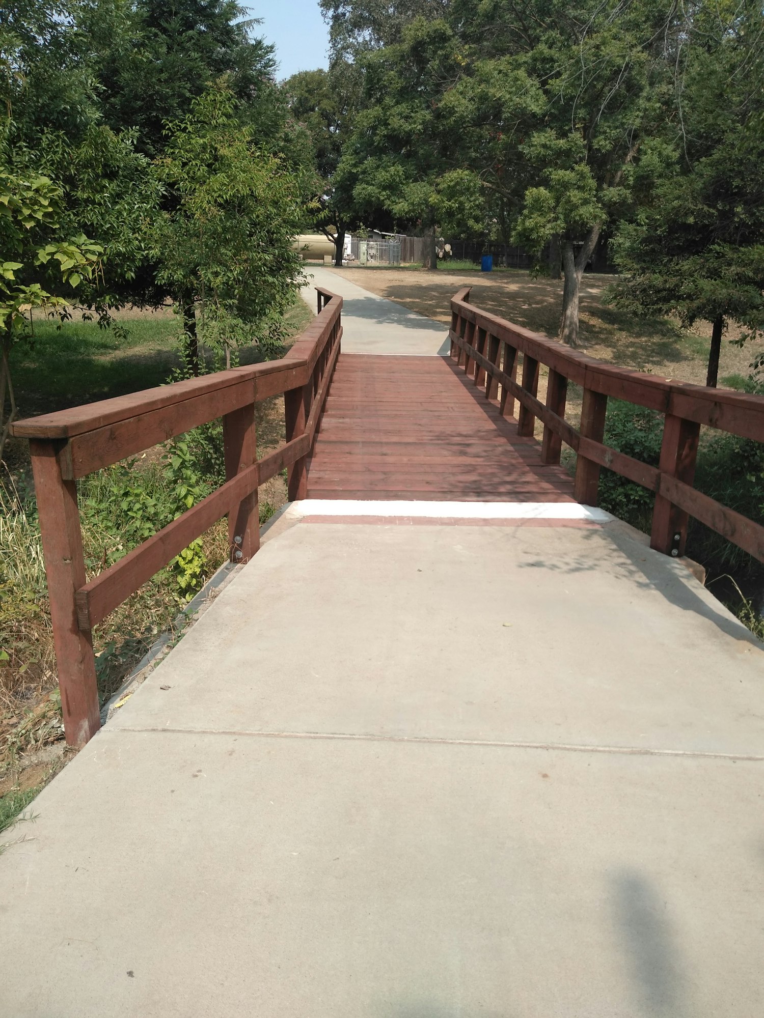 May contain: handrail, banister, building, bridge, boardwalk, and wood