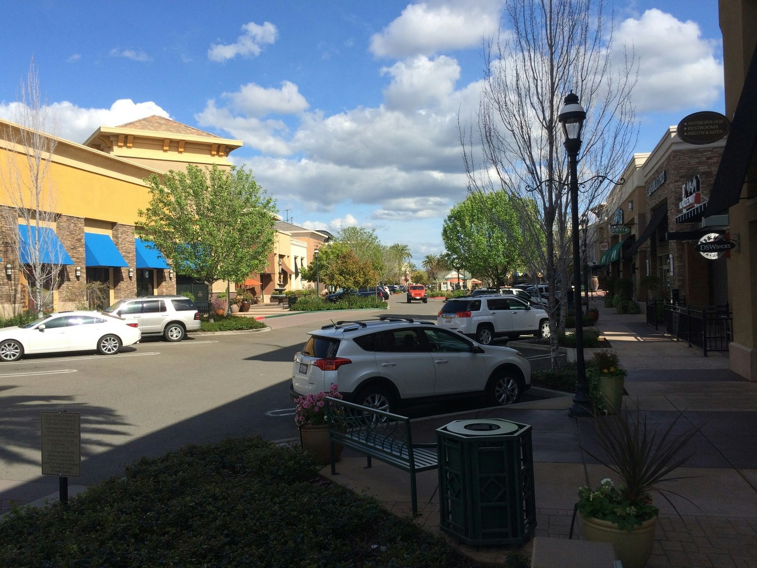 May contain: transportation, car, vehicle, automobile, road, urban, neighborhood, building, intersection, machine, and wheel