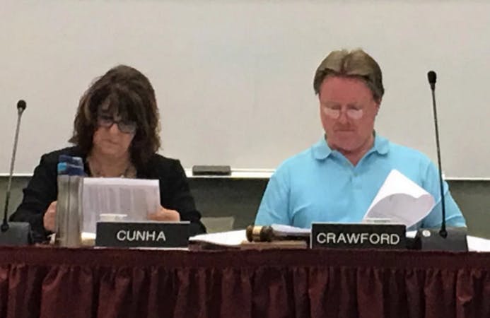 May contain: human, person, indoors, room, crowd, and audience