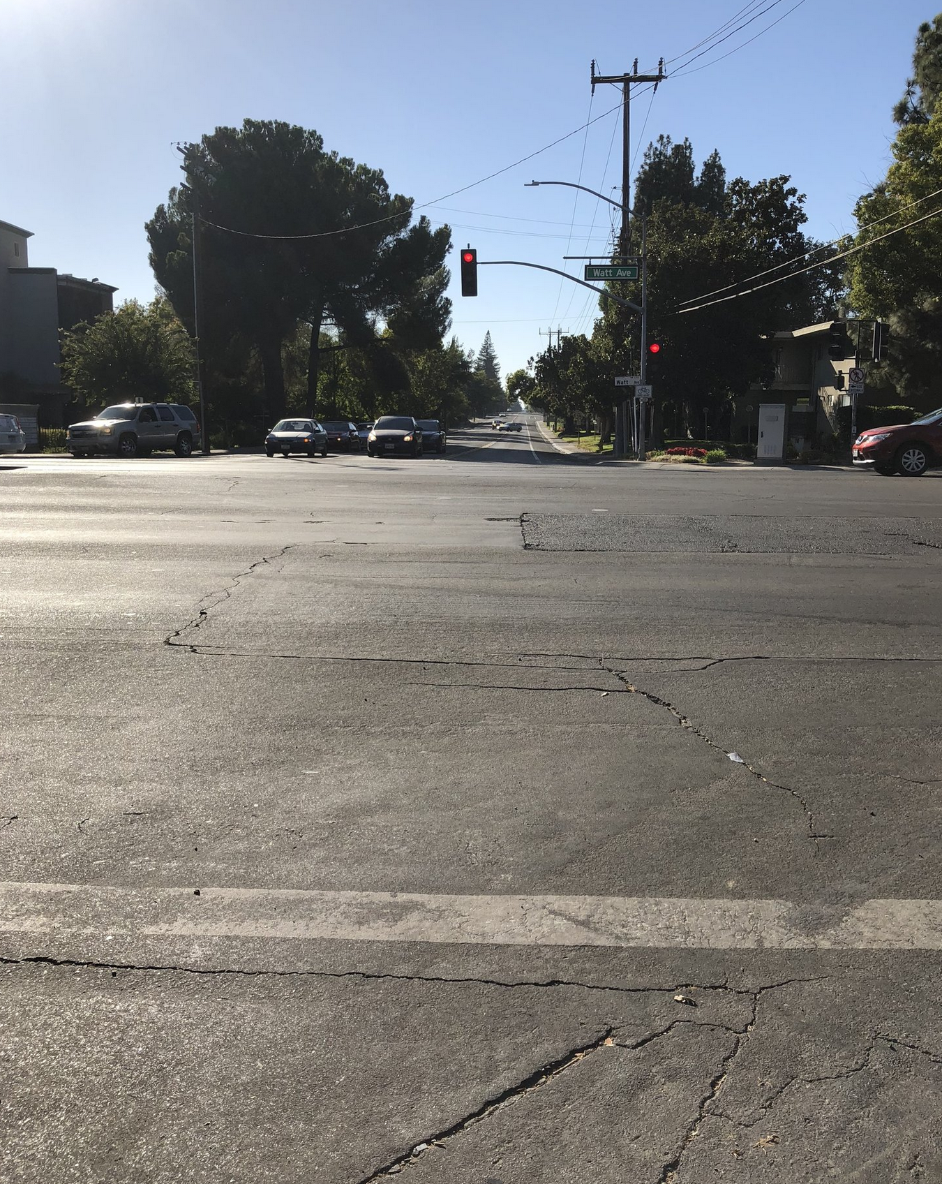 May contain: road, tarmac, asphalt, intersection, light, traffic light, automobile, transportation, car, and vehicle