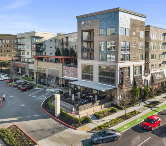 May contain: building, housing, condo, transportation, vehicle, car, automobile, urban, town, city, high rise, road, downtown, apartment building, office building, person, human, and intersection