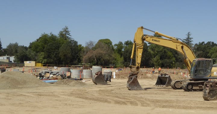 May contain: person, bulldozer, and machine