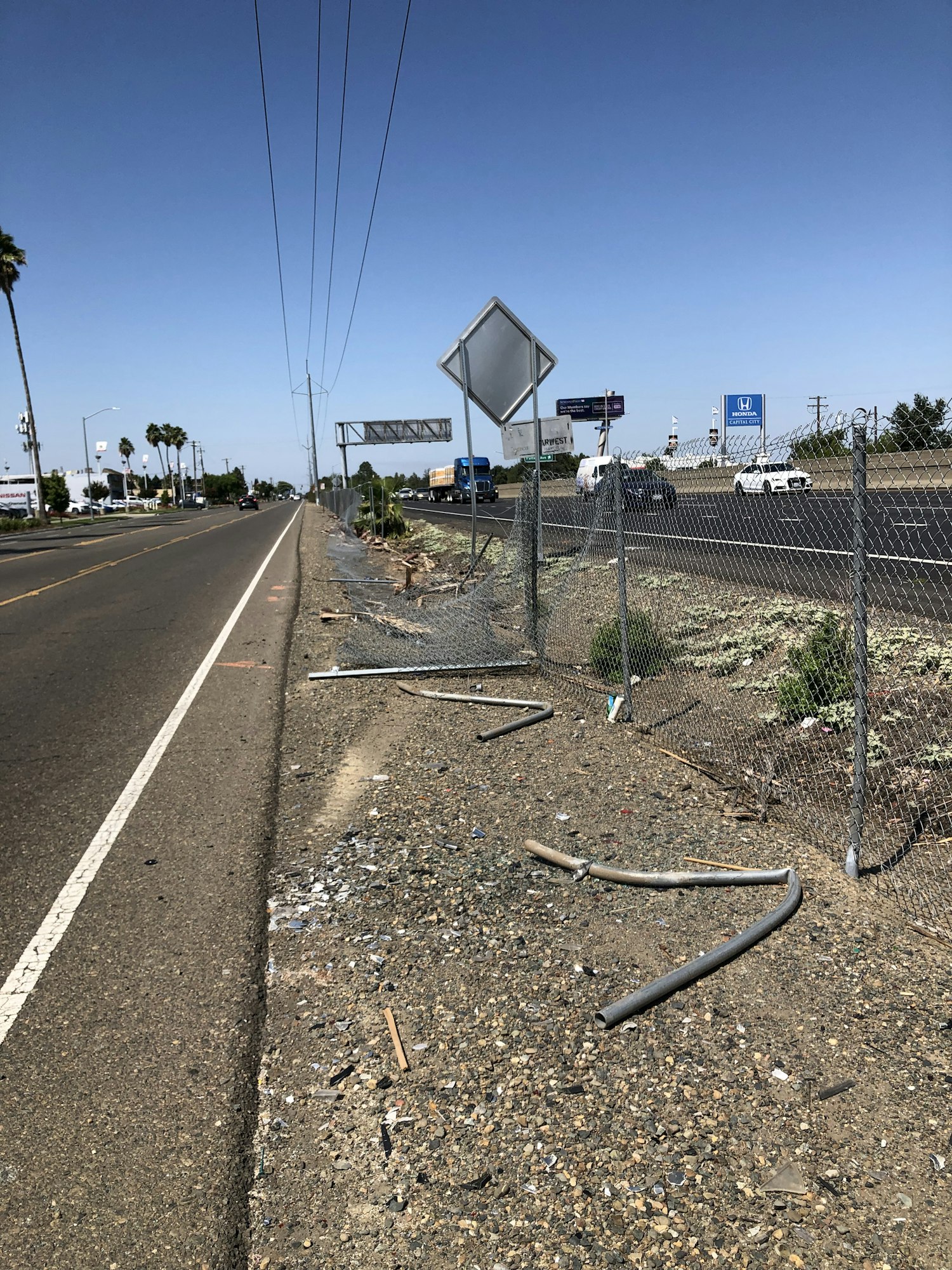 crash site with damaged fence